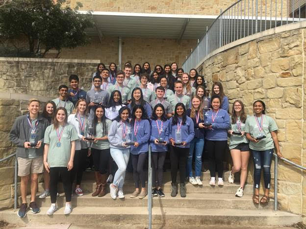 Students advancing to ICDC pose for a picture with their awards.