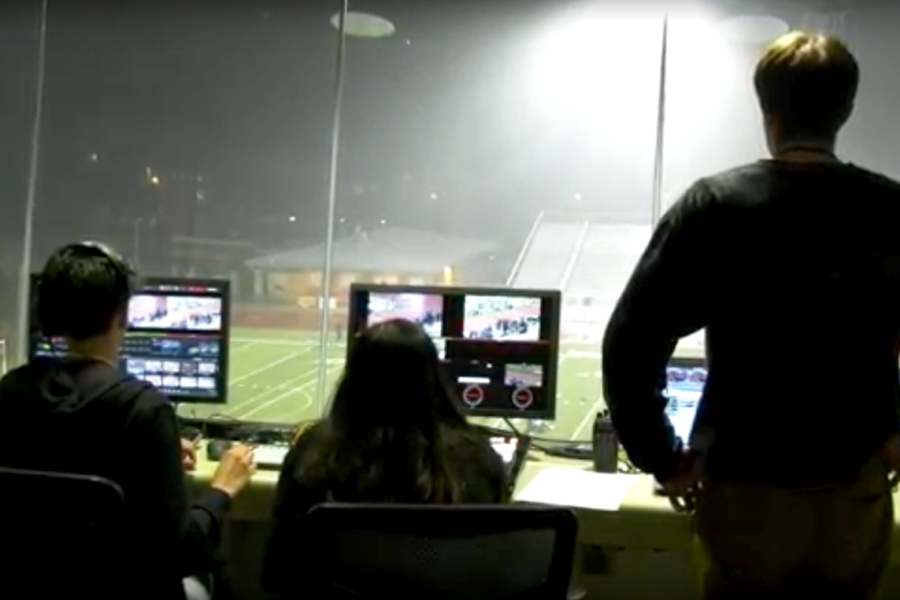 Operating from the press box, AV broadcasts the middle school track meet.