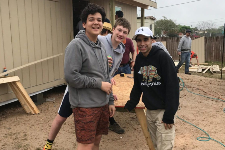 Sophomore Alex Smith (left) with other volunteers building houses is Penitas, Texas.