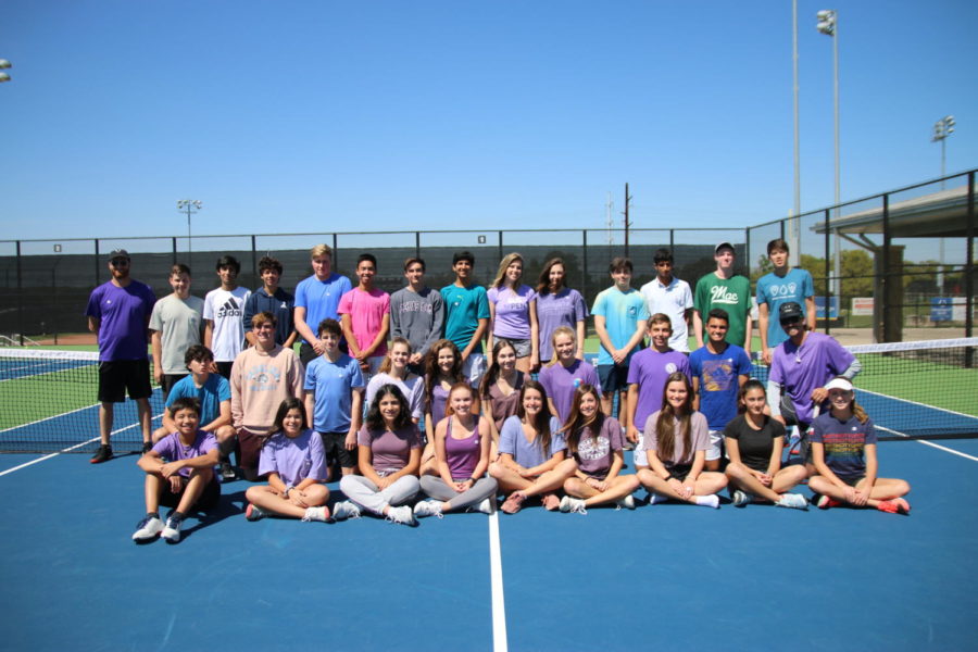 The+tennis+team+smiles+as+they+wear+purple+for+Epilepsy+Awareness+Day.+