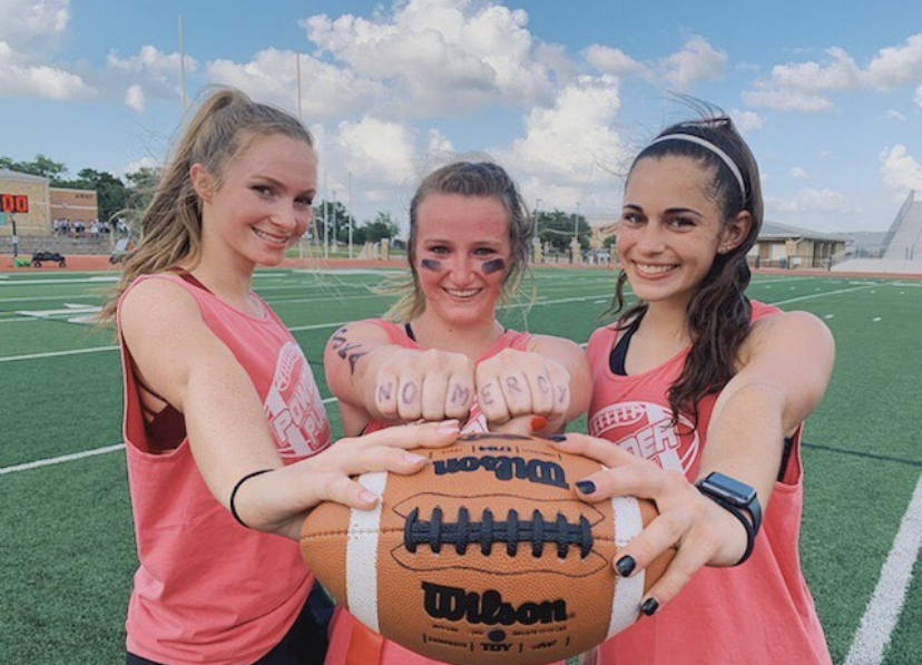 Seniors Jennifer Moore, Amelia Milam, and Lauren Brideau pose for a victory picture after the game.