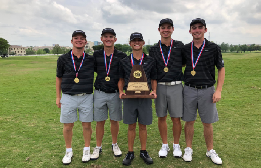 The boys golf team stand with their regional trophy 