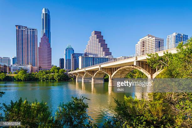 golden+hour+light+illuminates++Austin+Texas+skyline+with+Ladybird+Lake+and+Congress+Avenue+Bridge+in+foreground