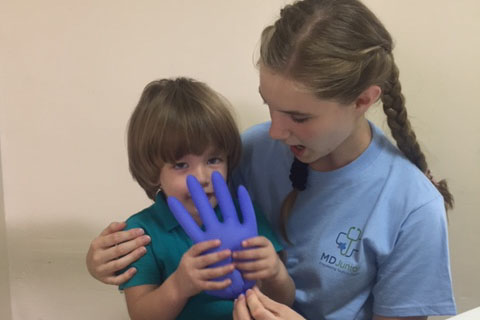 Junior Katie McClellan works at a local clinic during a medical mission trip to Puerto Rico. 