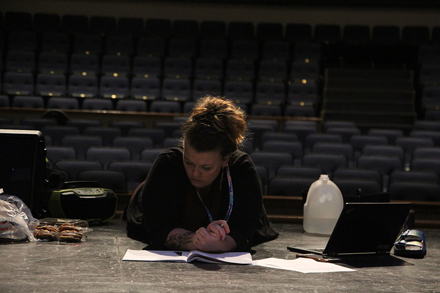 Director Celeste Schneider reads through her script as she writes out the blocking for future scenes. This is Schneider’s third musical at Vandegrift and has served as a vocal and acting coach for 10+ years.