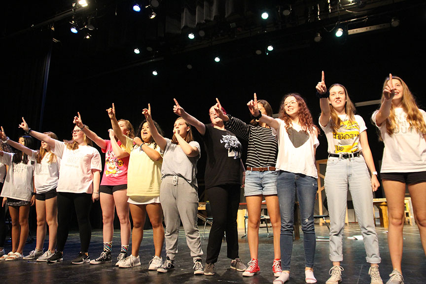 The ensemble joins leads Collier, Mendoza and Jones during the “Super Trouper” dance. They hold up a number one to go with the symbolism of the iconic line “feeling like a number one,” from the classic ABBA song. 