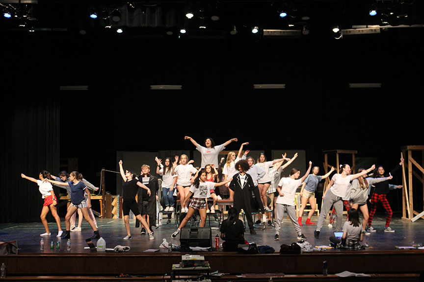 The ensembles surrounds Mendoza as the cast performs “Money, Money, Money.” This was the first number that was taught to the cast and the first big number the ensemble is in during the show. 