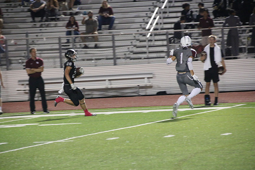 Before the end of the second quarter, Bowen Lewis scores a touchdown. Getting that touchdown was a really good motivator for our team going into halftime so we could finish strong, junior Bowen Lewis said.