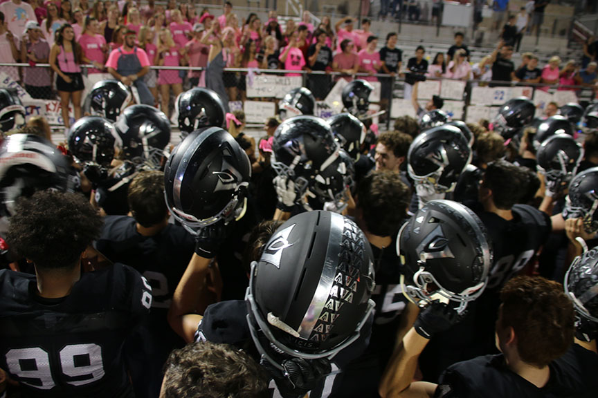 After the 32-25 win against Round Rock, Vipers huddled up while the band plays the fight song. Holding our helmets together after the game listening to our fight song, is awesome. We all just put in the work together to get the win, sophomore Landon Thomason said.