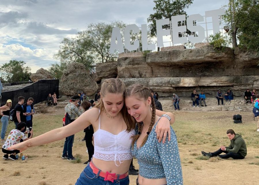 Katie McClellan and Meagan Henry pose in from of the classic ACL Fest sign.