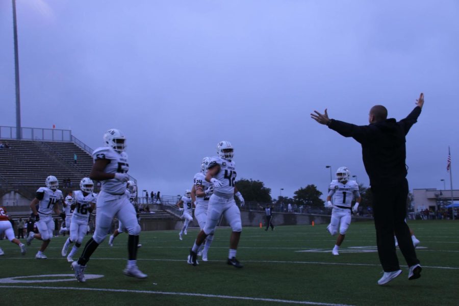 Coach Sanders cheers on a big play during Westwood game.