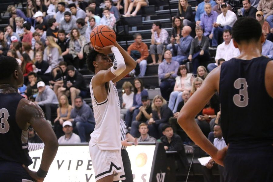 Greg Brown shoots the ball in the 3rd quarter against Hendrickson.