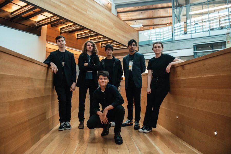 Noah Levine standing with his band Noah in the Open at their TEDx Conference performance.