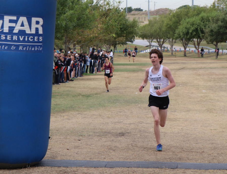 Junior varisty runner Alex Rayson takes his last few strides for the win.
