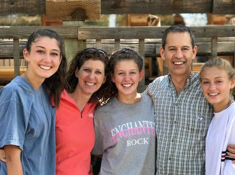 Lisa Denison (left of center) and her daughters Antonia (left), Caroline (center), Natalie (right), and husband.