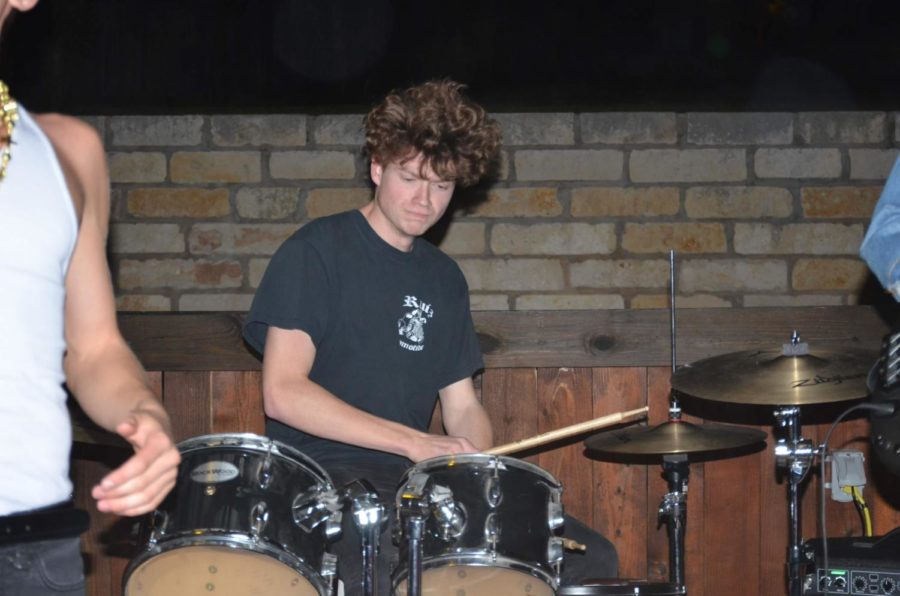 Senior Mick Smith drumming along to Dad Chairs original song, Fake Friends.