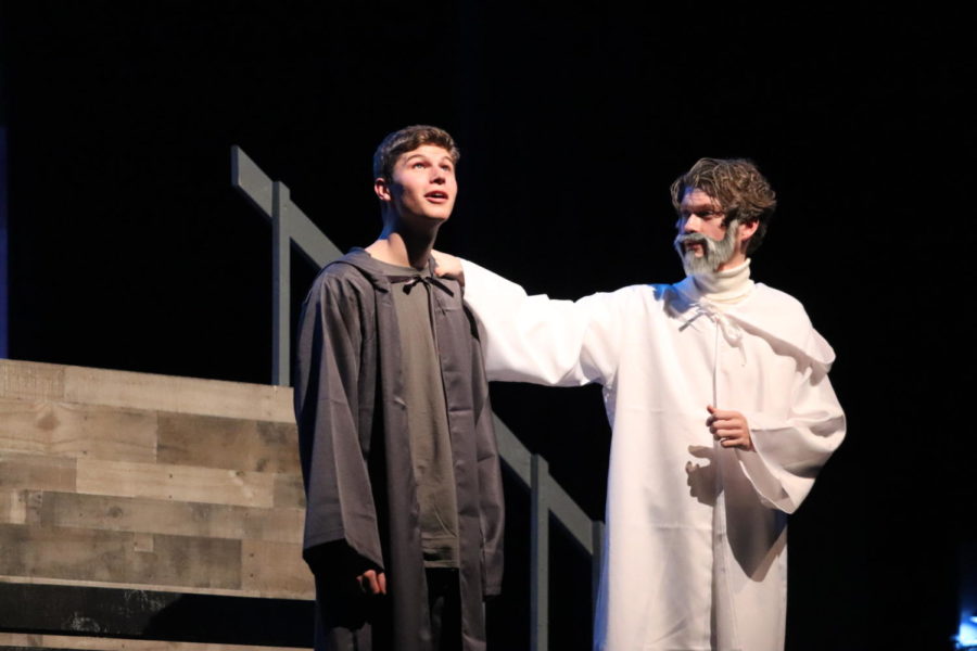Jonas, Matthew Taylor (left), and The Giver, Mick Smith (right), share a memory onstage.