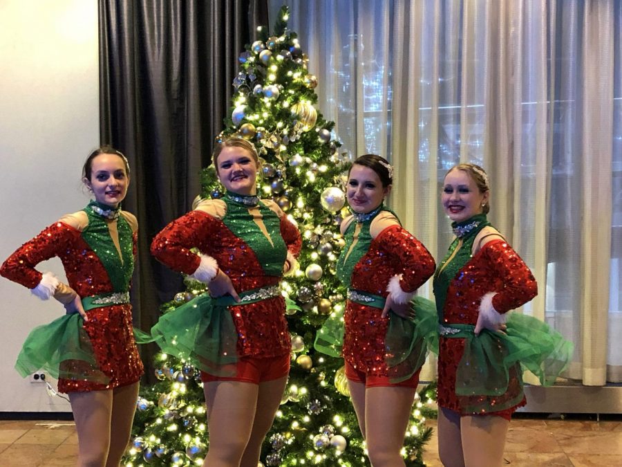 Avery Lewis, Sydney Bell, Faith Anton and Audrey Brink (left to right) pose in their uniforms on the day of the parade. 