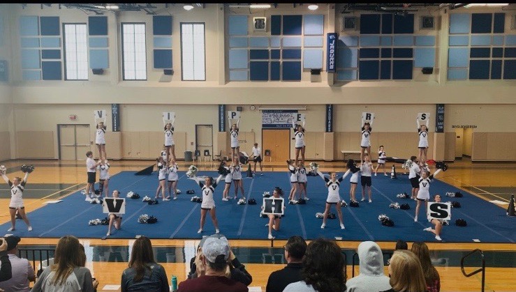 Cheerleaders and flag boys during performance