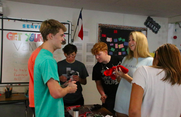 BRAVE students wrap socks for local homeless donation.