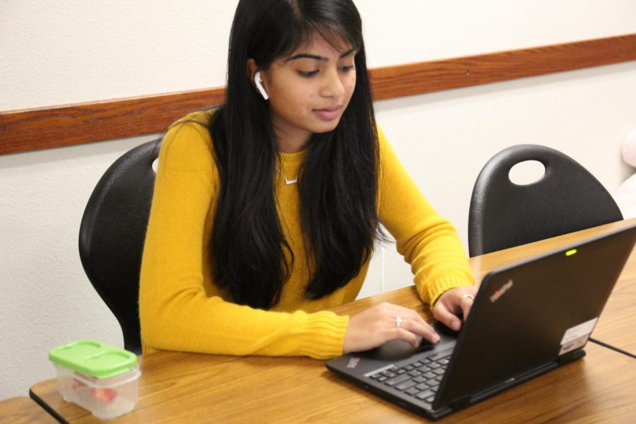 Suthar reviews her extended research paper during pit in her IB English class