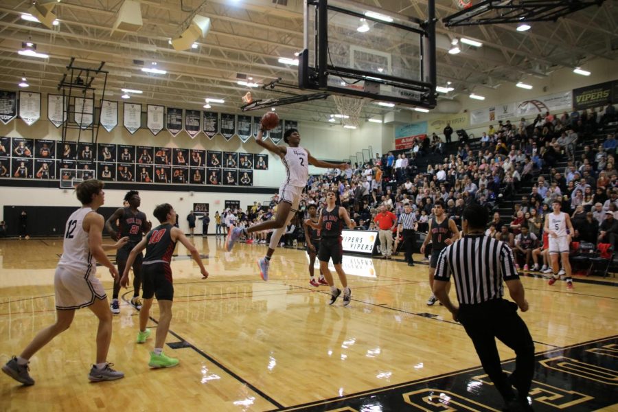 Senior Greg Brown goes in for a dunk to help win 63 to 46 against Vista Ridge.