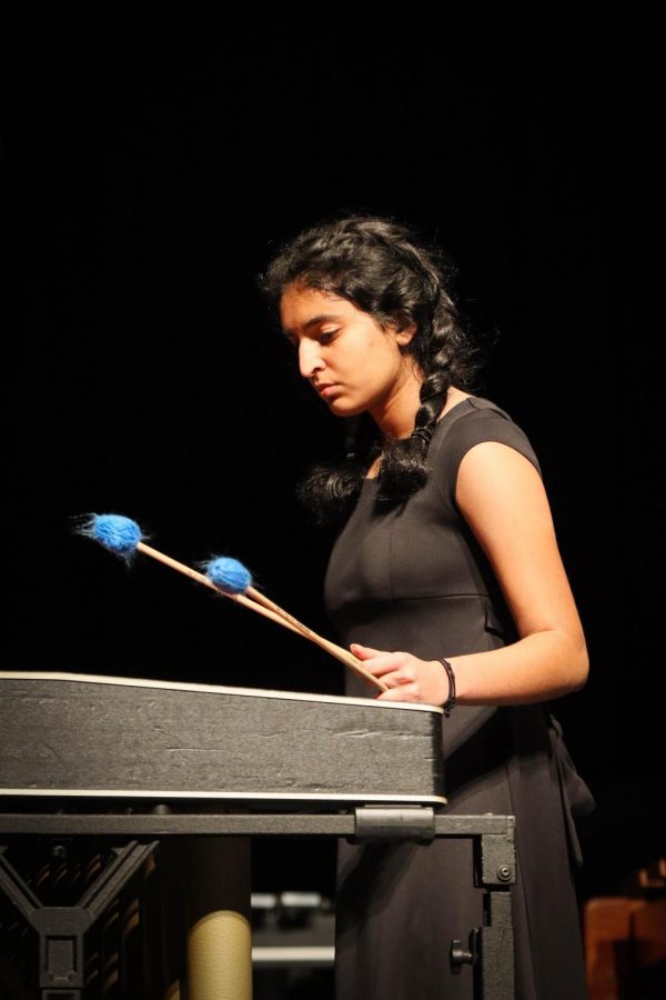 Freshman Neha Ramachandran preforms in the opening Symphonic ensemble piece. 