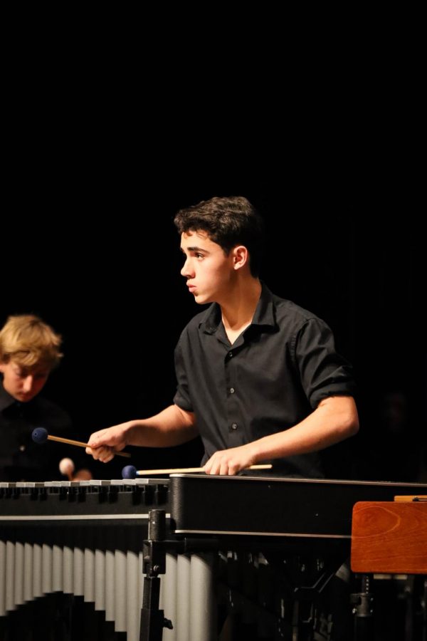 Sophomore Nick Silva performs an ensemble piece on the vibraphone. Silva multitasked playing and watching the conductor to ensure that the piece didnt fall apart. 