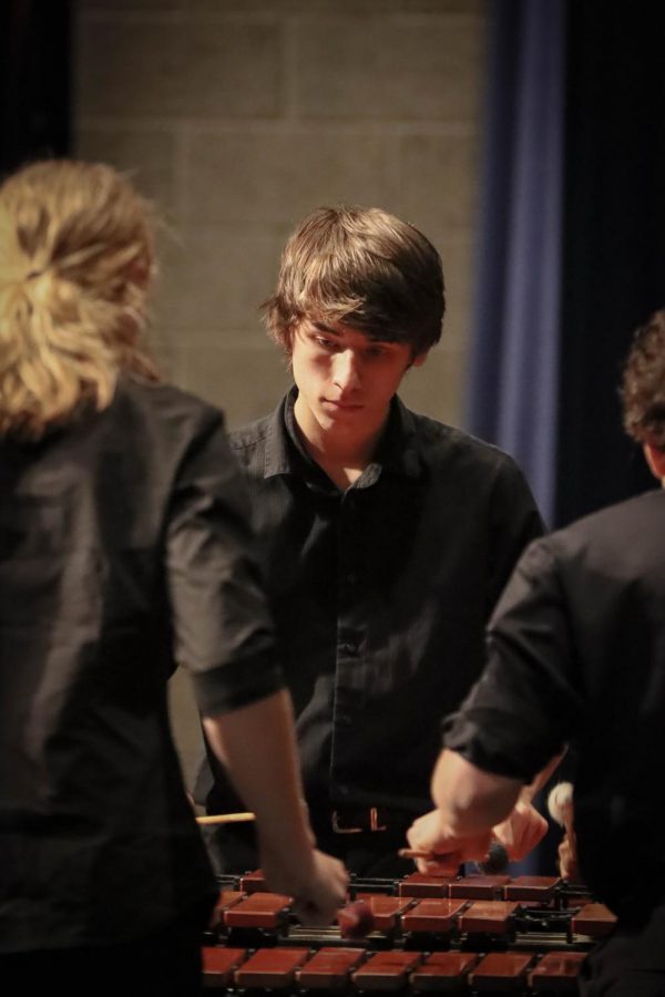 Junior Kaelen Maranelli preforms in the Symphonic ensemble. Maranelli and two other Symphonic band members worked together to complete this complex piece involving rotations around a marimba. 