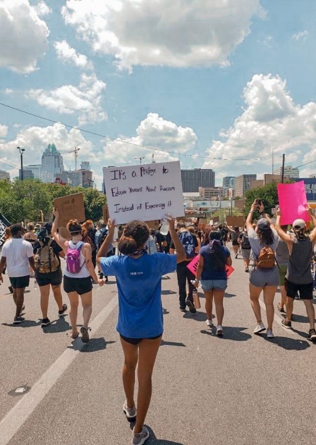 Freshmen+Tiffany+Colston+marches+downtown+while+practicing+social+distancing+at+a+Black+Lives+Matter+protest.+