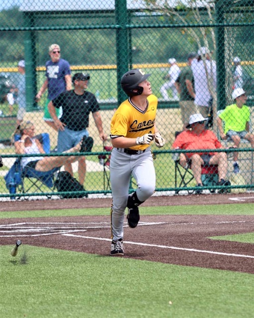 Sophomore baseball player Brayden Buchanan runs towards base from home plate.