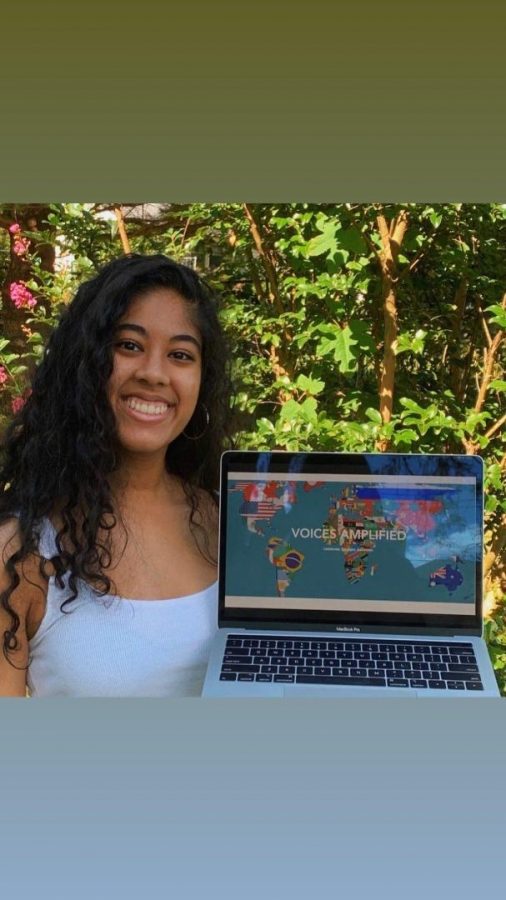 Founder of Voices Amplified, Maiya Angelou, shows organization's new website.