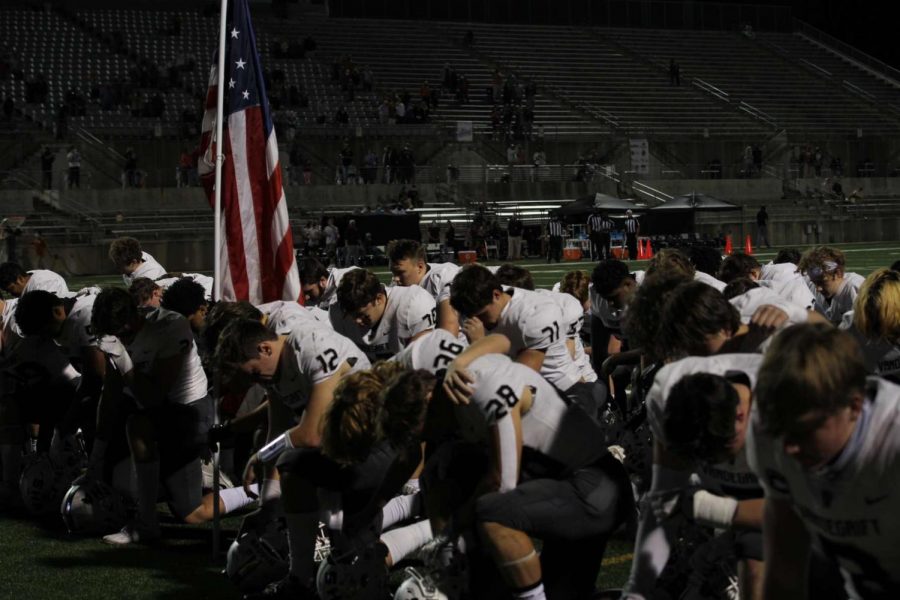The Vipers kneel at the end zone as senior captain Ryan Back prays with his team before the game begins. Back, number 12, is the team’s quarterback and prioritizes praying before every game as the intensity builds up. “In the football program we emphasize more than just football, but the development of our character as young men,” Back said. “Football has taught me discipline, teamwork. and leadership. I’m motivated to play and get better each week as I know my teammates are counting on me.”