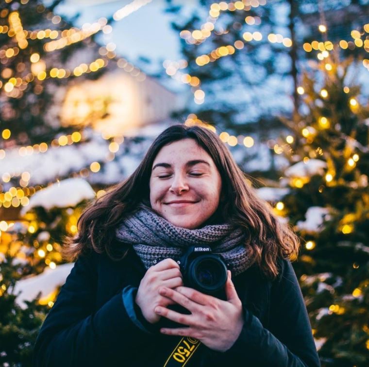 McKenna Shuster holding her camera in the chilly Boston snow