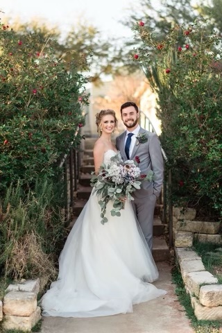 Alex Lutz and Elise Lutz pose for a picture during their wedding.