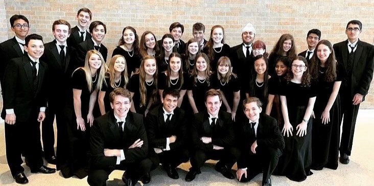 Galligher+and+Connors+standing+with+their+choir+family+at+the+region+competition+last+year