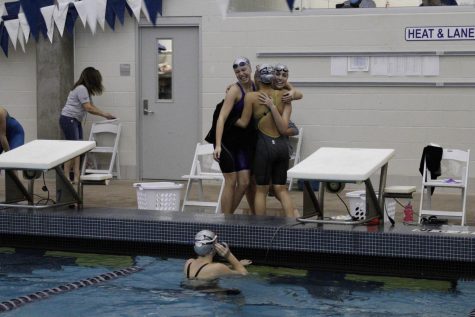 Girls on the 200 free relay react to placing third.