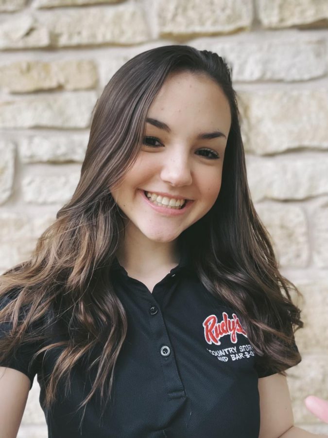 Junior Grace Deragon wears her uniform to go to work at Rudys BBQ.