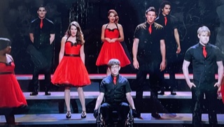 Some members of the Glee Club performing We are the Champions in Season 3 episode 21