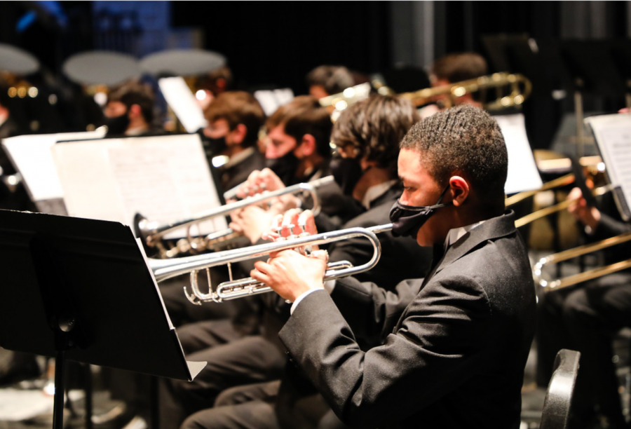 Trumpet players from the wind ensemble perform at the concert portion of the competition