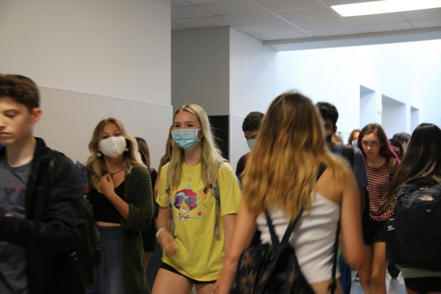 Students walk through the halls during a passing period.