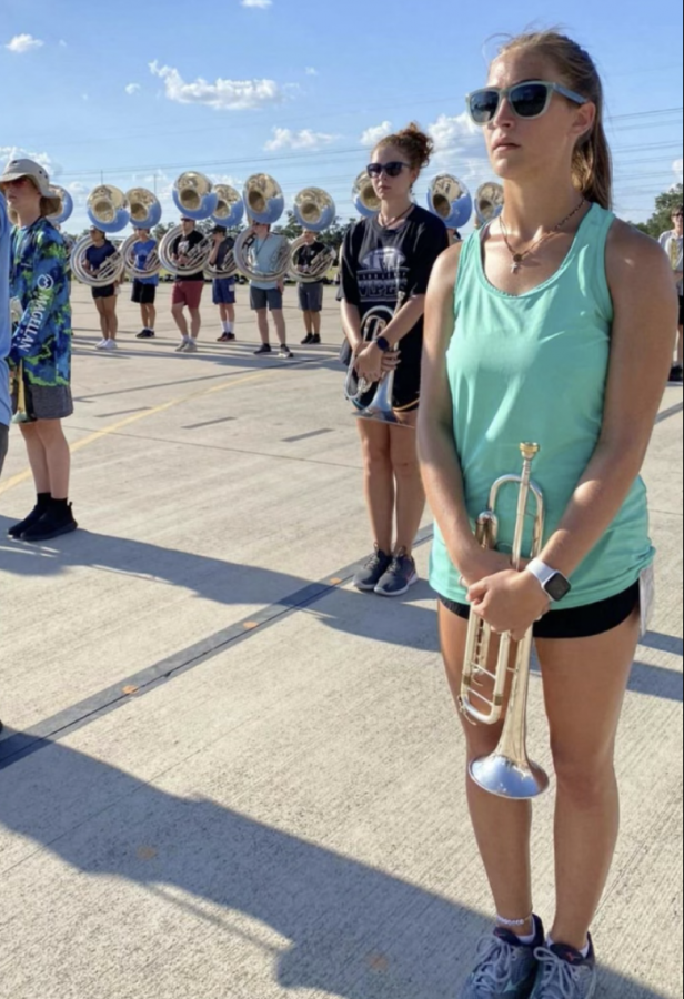 Students+ready+in+the+heat+of+the+summer+to+practice+playing+and+marching.+Photos+by+Isabela+Rotendaro+