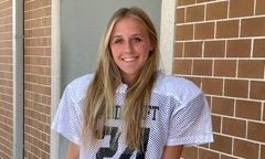 Elena Welch, all decked out in her football uniform, ready to go practice with the freshman football team