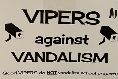 Posters are now being hung in front of the bathroom doors of what is considered vandalism, what you should do if you see vandalism, and the consequences for vandalism