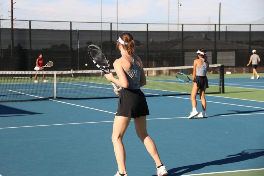 Two of the varsity tennis girls getting ready to go up against Belton in their match