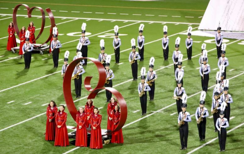 The band standing tall in preparation to start the show