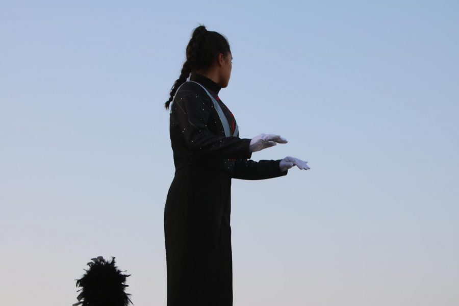 One of the drum majors conducts the Juliet Letters performance