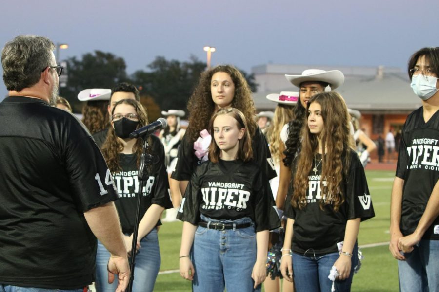The Vandegrift Choir sings the National Anthem at the homecoming game.