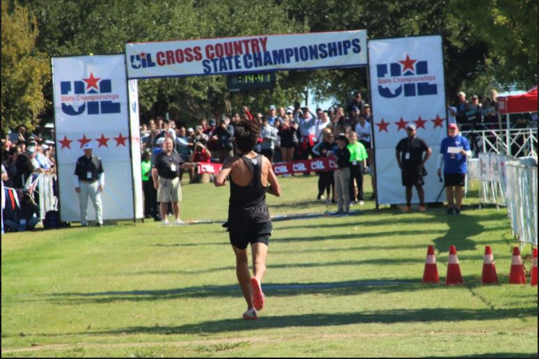 Junior Kevin Sanchez prepares to cross the finish line. 