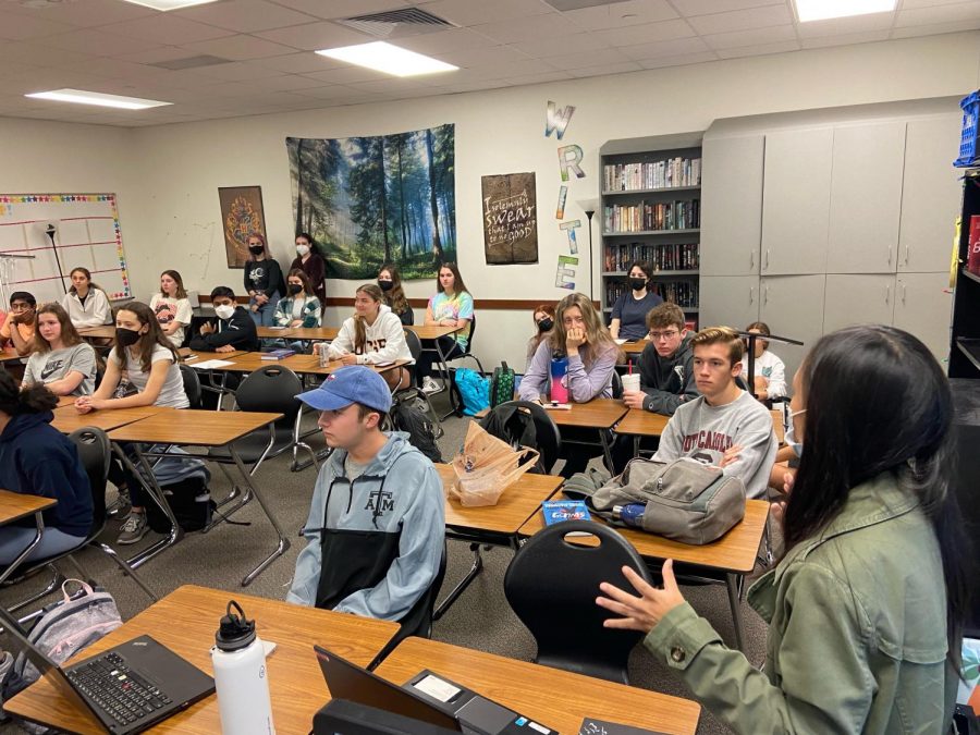 During this December meeting, NEHS members gather together to listen to vice-president Karis Hu. 